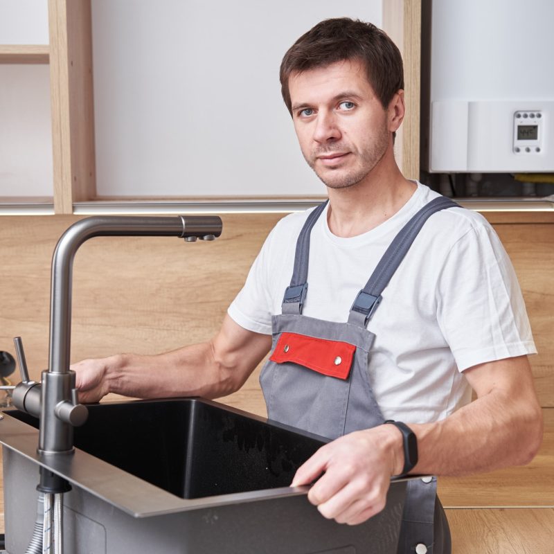 male-plumber-install-sink-in-the-kitchen.jpg